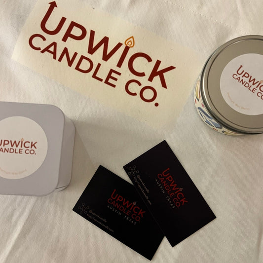 UpWick Candle Company Mini Candles and Business cards on a branded apron