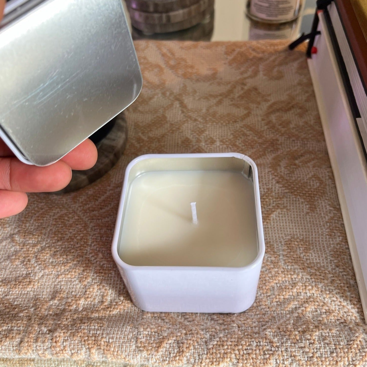 Mini candle on mirrored coffee table. 